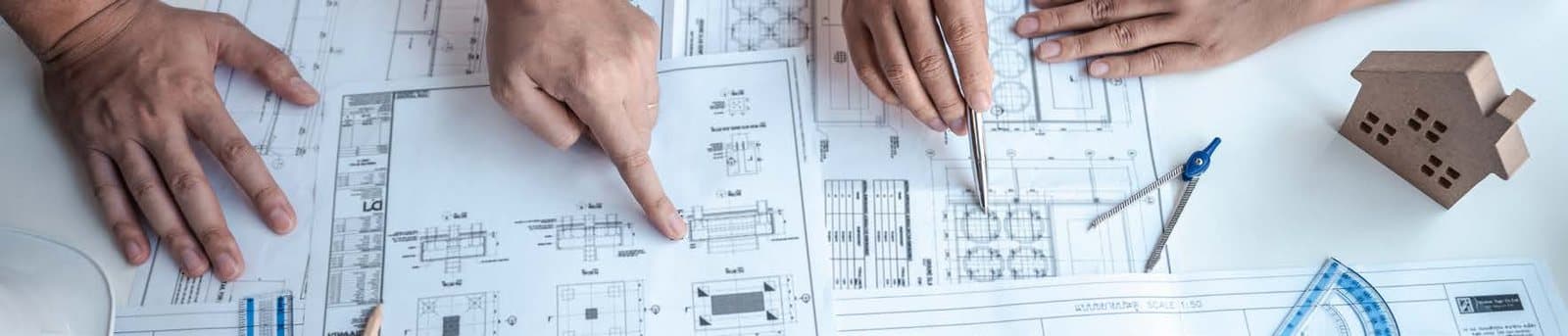 Architectural plans being reviewed on a desk